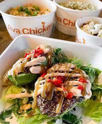 Viva Chicken signature dishes Pollo a la Brasa (Peruvian Rotisserie Chicken), Quinoa Stuffed Avocado, Tacu Bowl, Arroz Chaufa